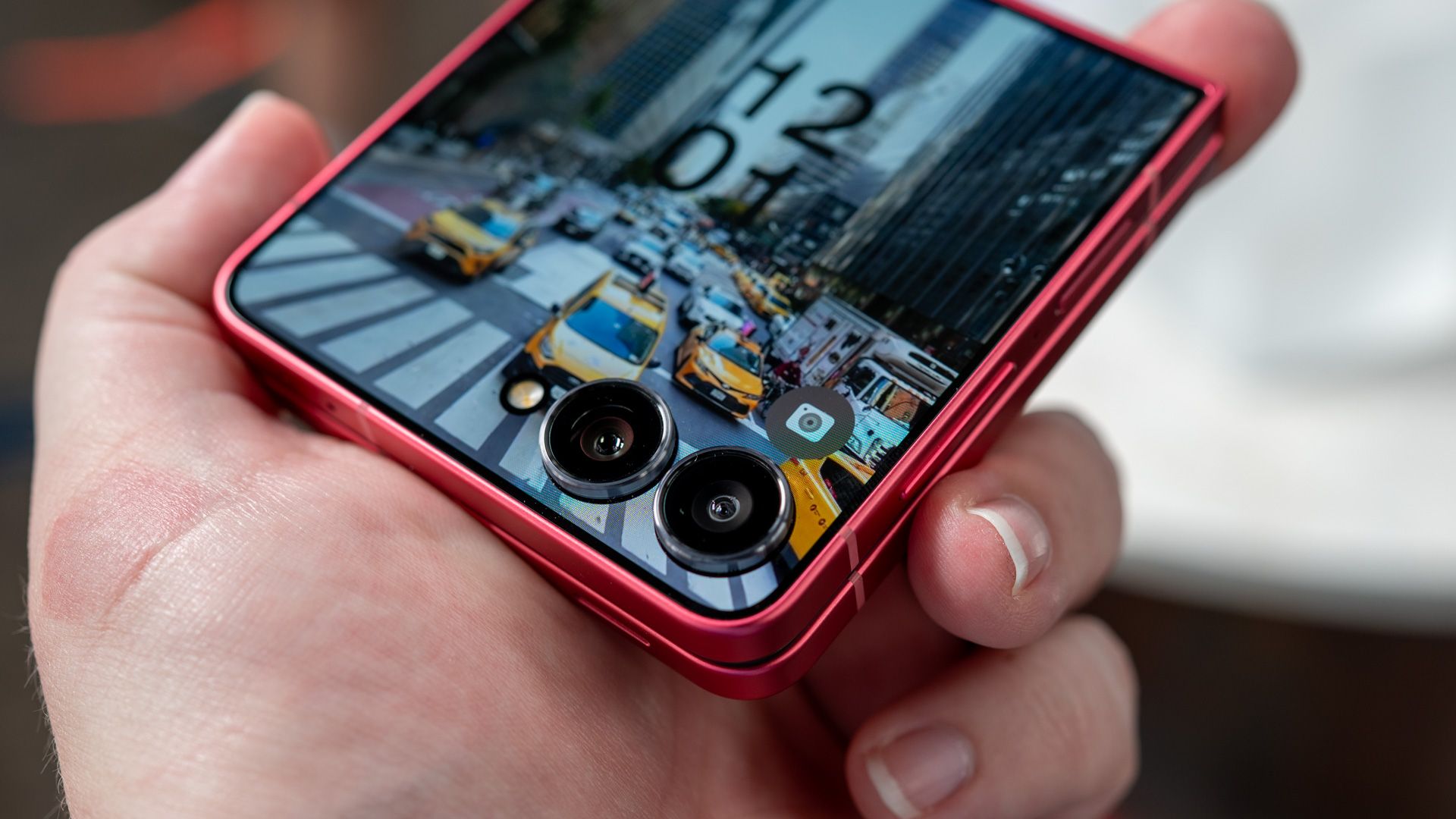 person holding the samsung galaxy z flip 7 showing the primary cameras 54642055441 o-1
