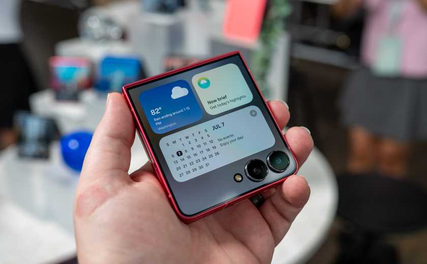 person holding the samsung galaxy z flip 7 showing widgets on the cover display 54642055506 o-1