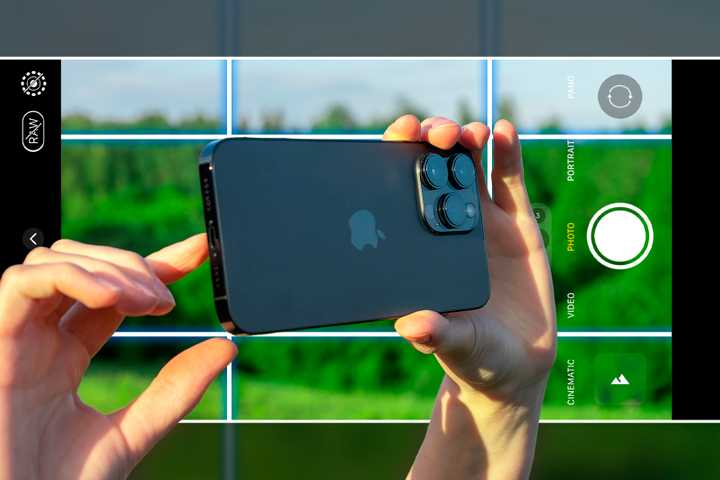 Person taking a photo with their iPhone.