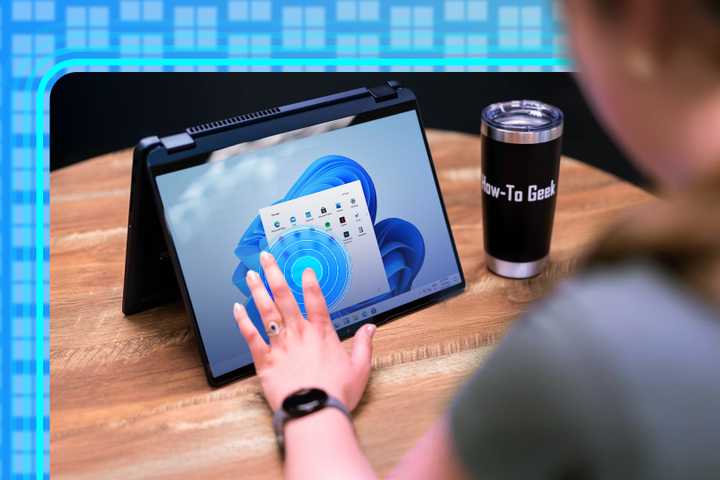 Person using the touch screen on a windows 11 laptop.