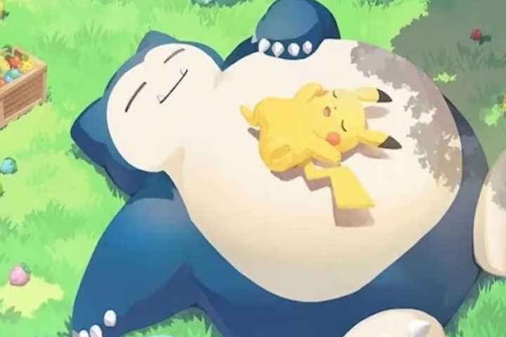 Pikachu sleeping atop Snorlax.