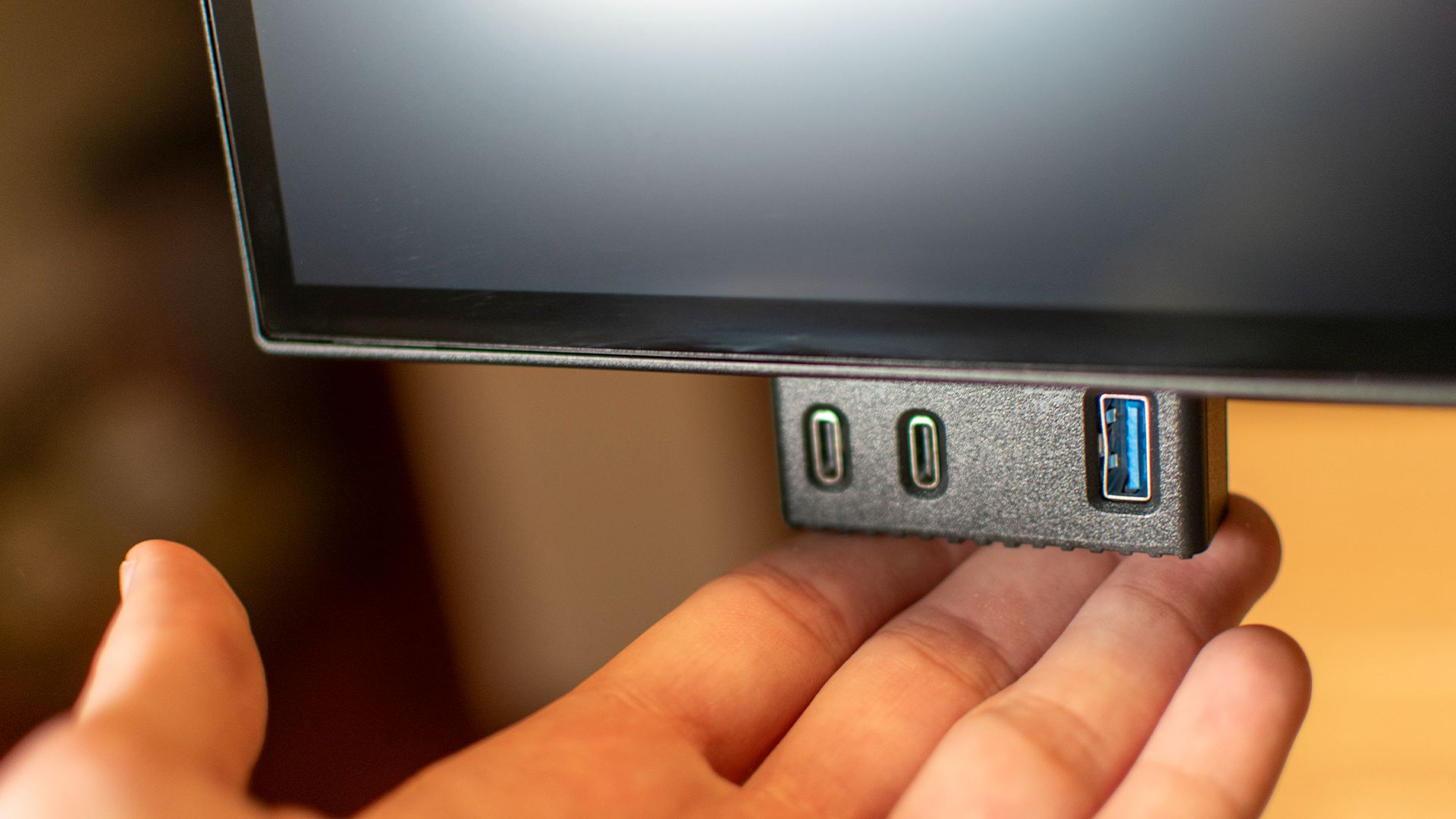 Popout USB ports on a Dell Ultrasharp 27 Thunderbolt Hub monitor.
