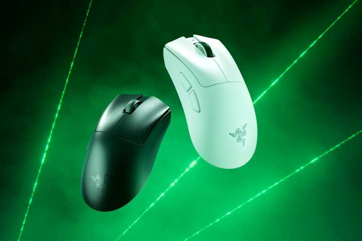 Razer DeathAdder V4 Pro white and black mouses on a green smoke background