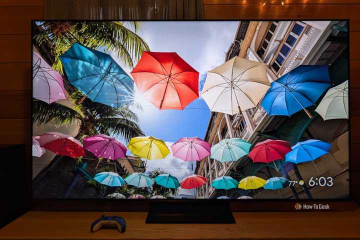 The Hisense 75U75QG in a dim room with umbrellas on the screen. 