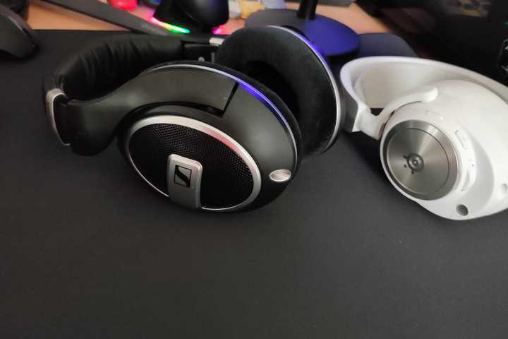 The Sennheiser HD 599 SE open-back headphones next to the SteelSeries Arctis Nova Pro Wireless closed-back headset.