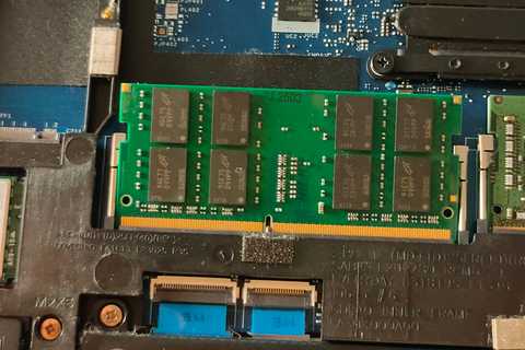 A stick of DDR4 RAM inside of a laptop.