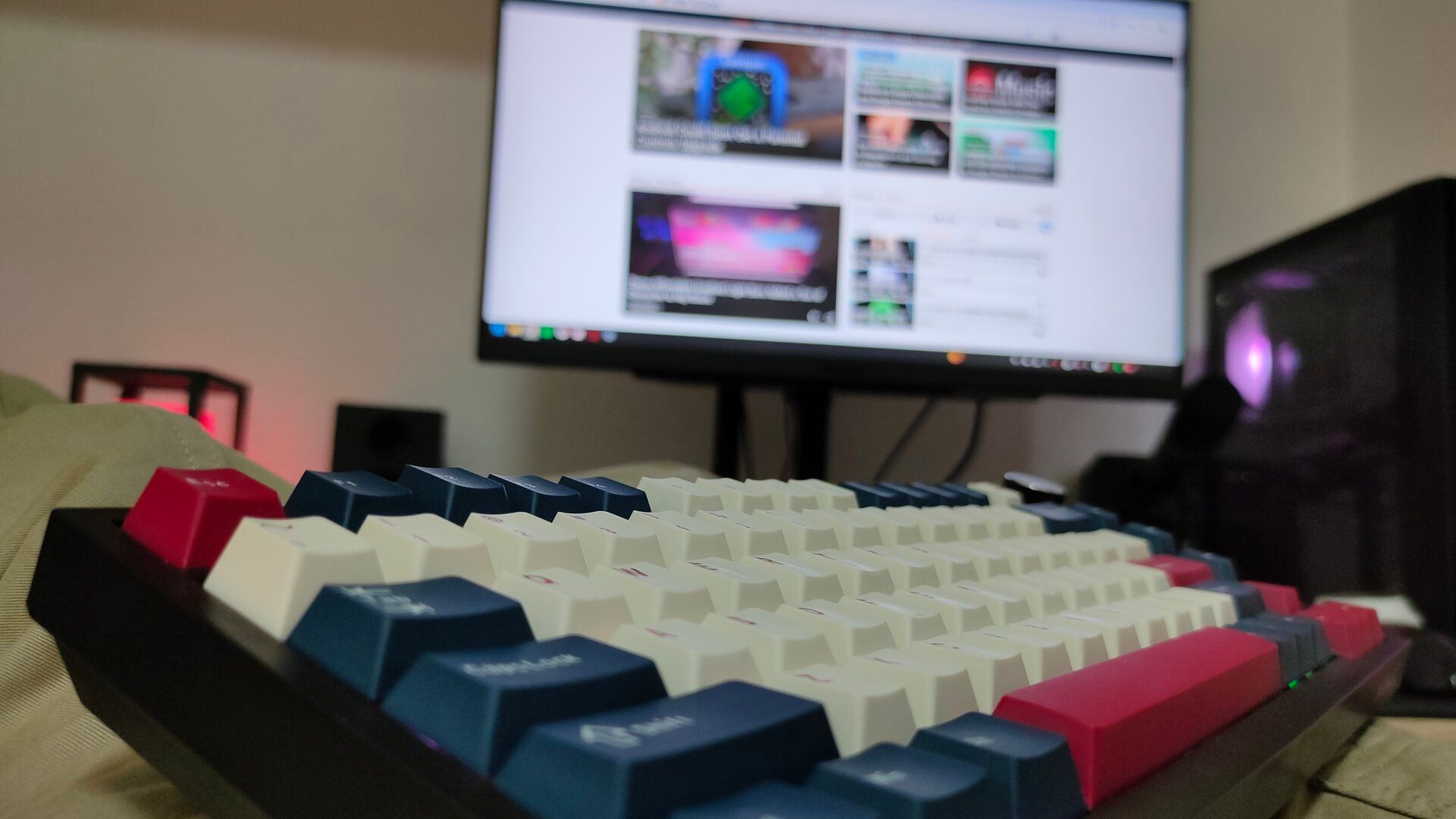 A wireless mechanical keyboard on a lap.