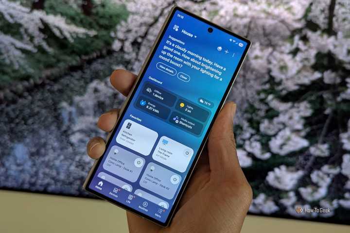 Samsung SmartThings on a Galaxy Z Fold 6 in front of a Frame TV.