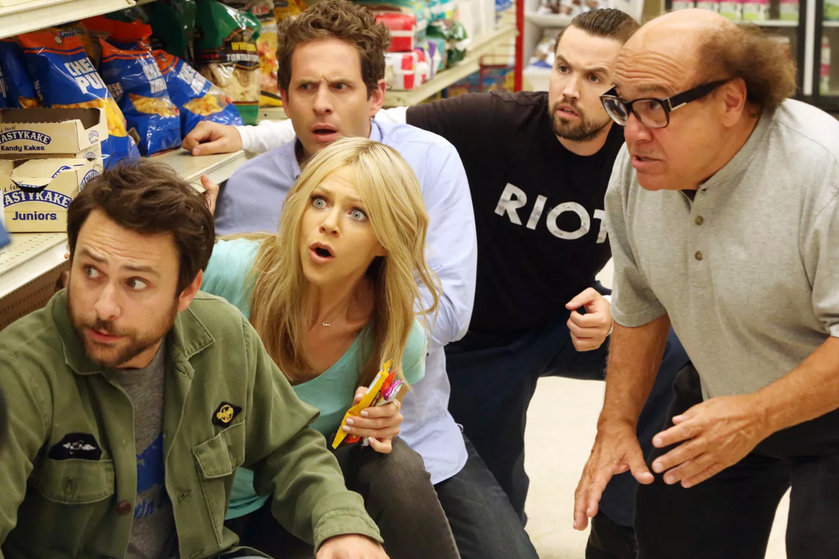 The Gang from It's Always Sunny in Philadelphia huddled on the floor in a convenience store.