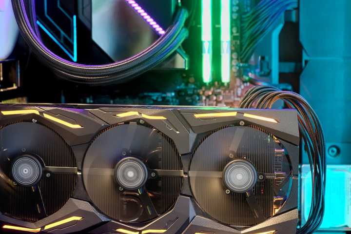 Closeup of a GPU operating inside a PC gaming rig with RGB lighting.