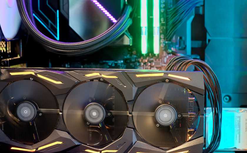 Closeup of a GPU operating inside a PC gaming rig with RGB lighting.