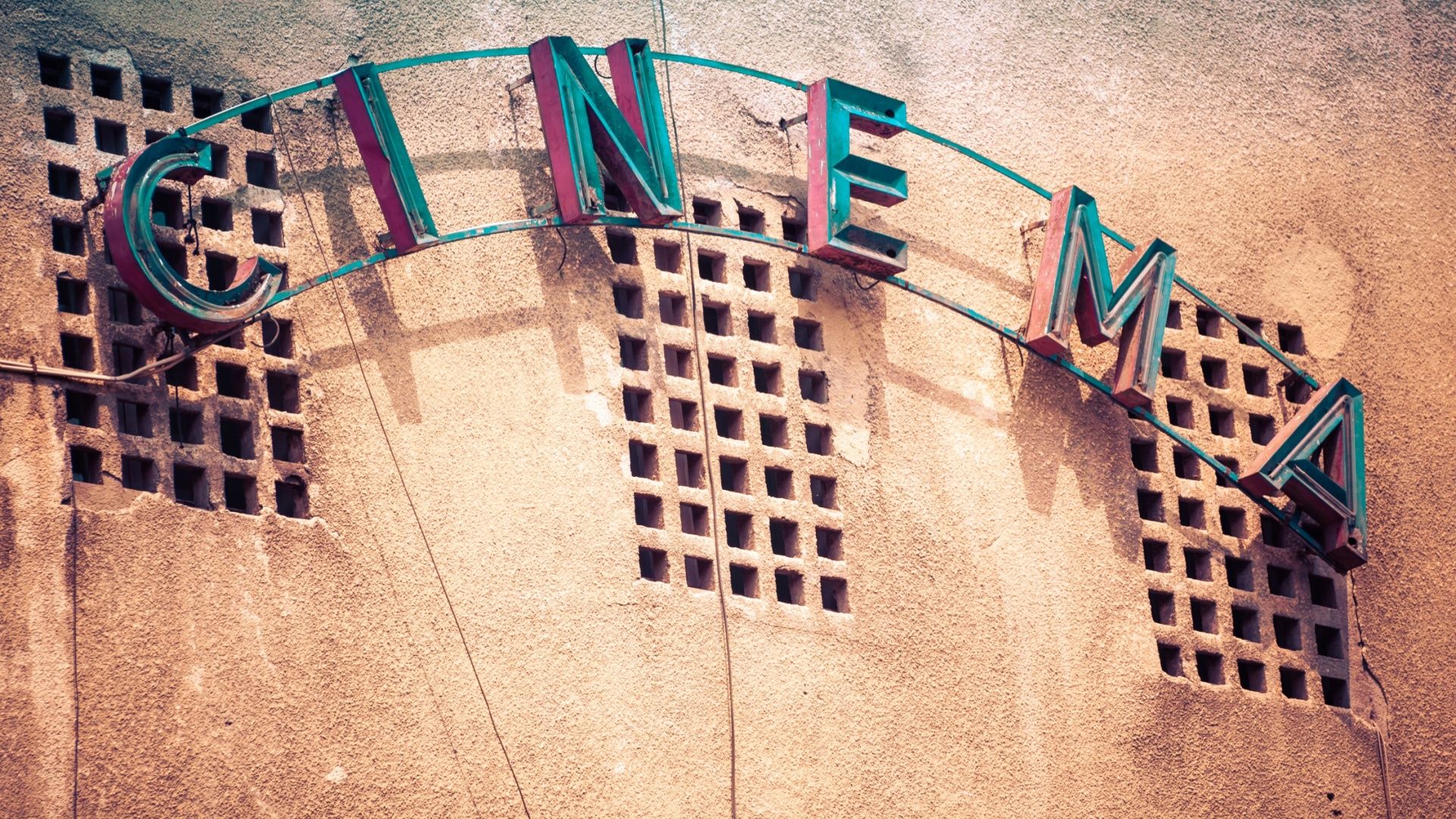 Vintage facade of old cinema in Bucharest Romania.