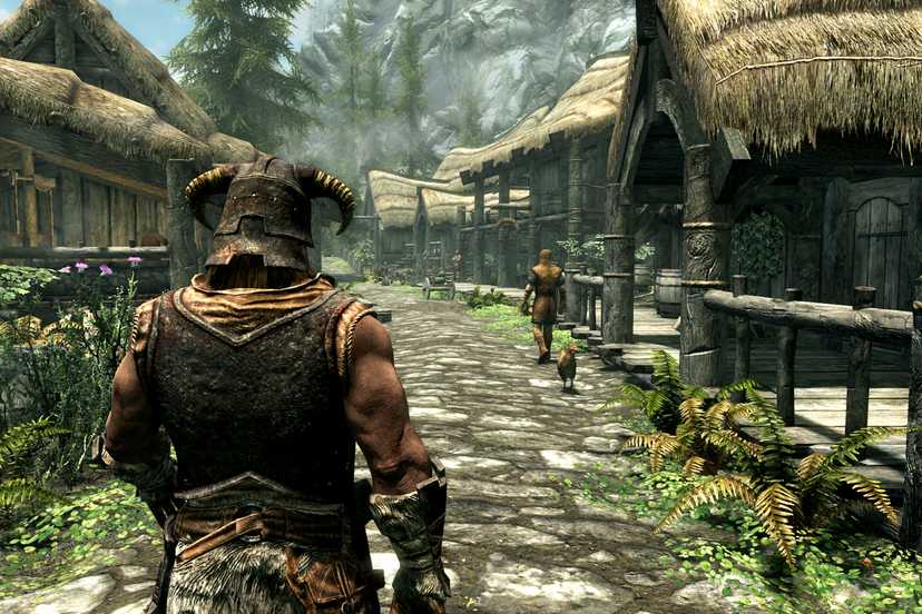 The main character walking down a road in Riverrun in The Elder Scrolls V: Skyrim.