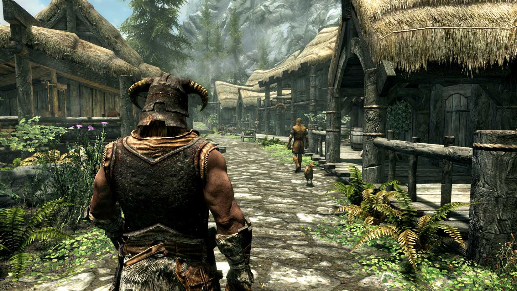 The main character walking down a road in Riverrun in The Elder Scrolls V: Skyrim.