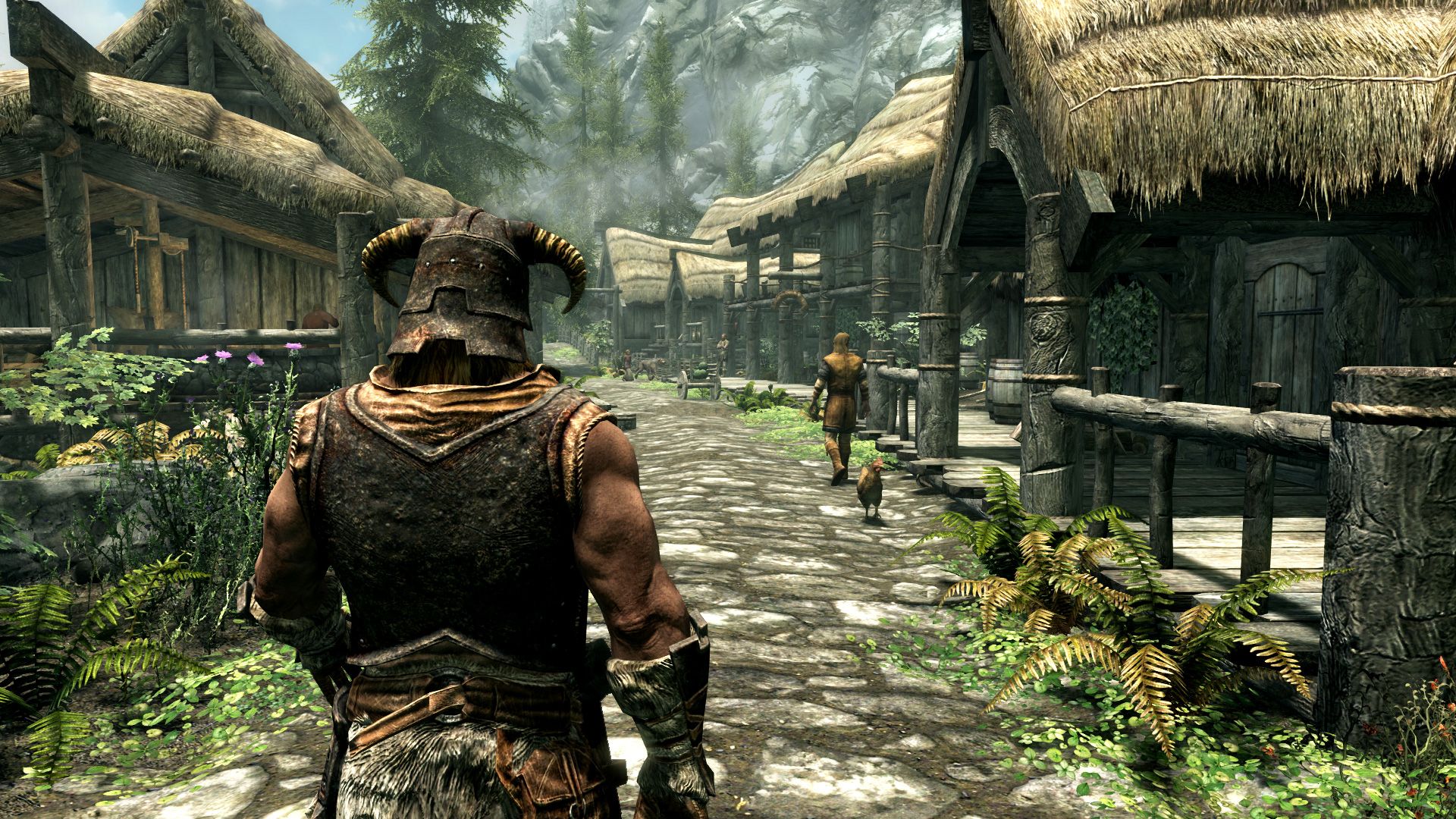 The main character walking down a road in Riverrun in The Elder Scrolls V: Skyrim.