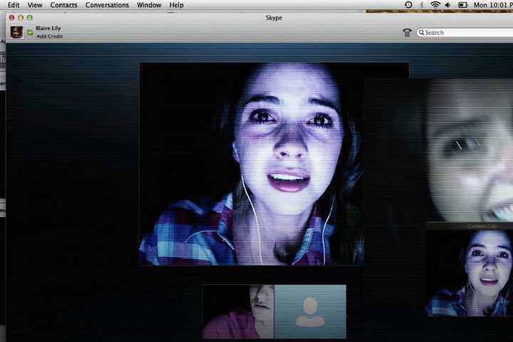 Teenage woman with open Skype windows from the movie Unfriended