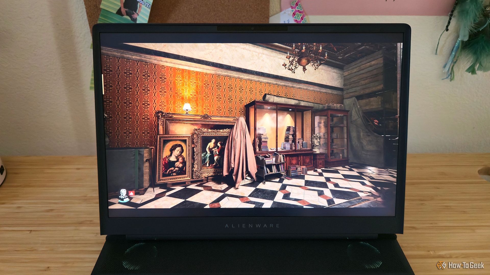 The game 'Indiana Jones and the Great Circle' playing on the Alienware 16 Area-51 gaming laptop.