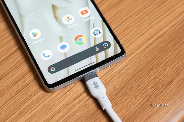 The Hyper HyperJuice 240W Silicone USB-C to USB-C Cable plugged in a phone.
