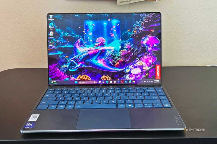 The Lenovo Yoga Slim 9i Gen 10 laptop open on a desk.