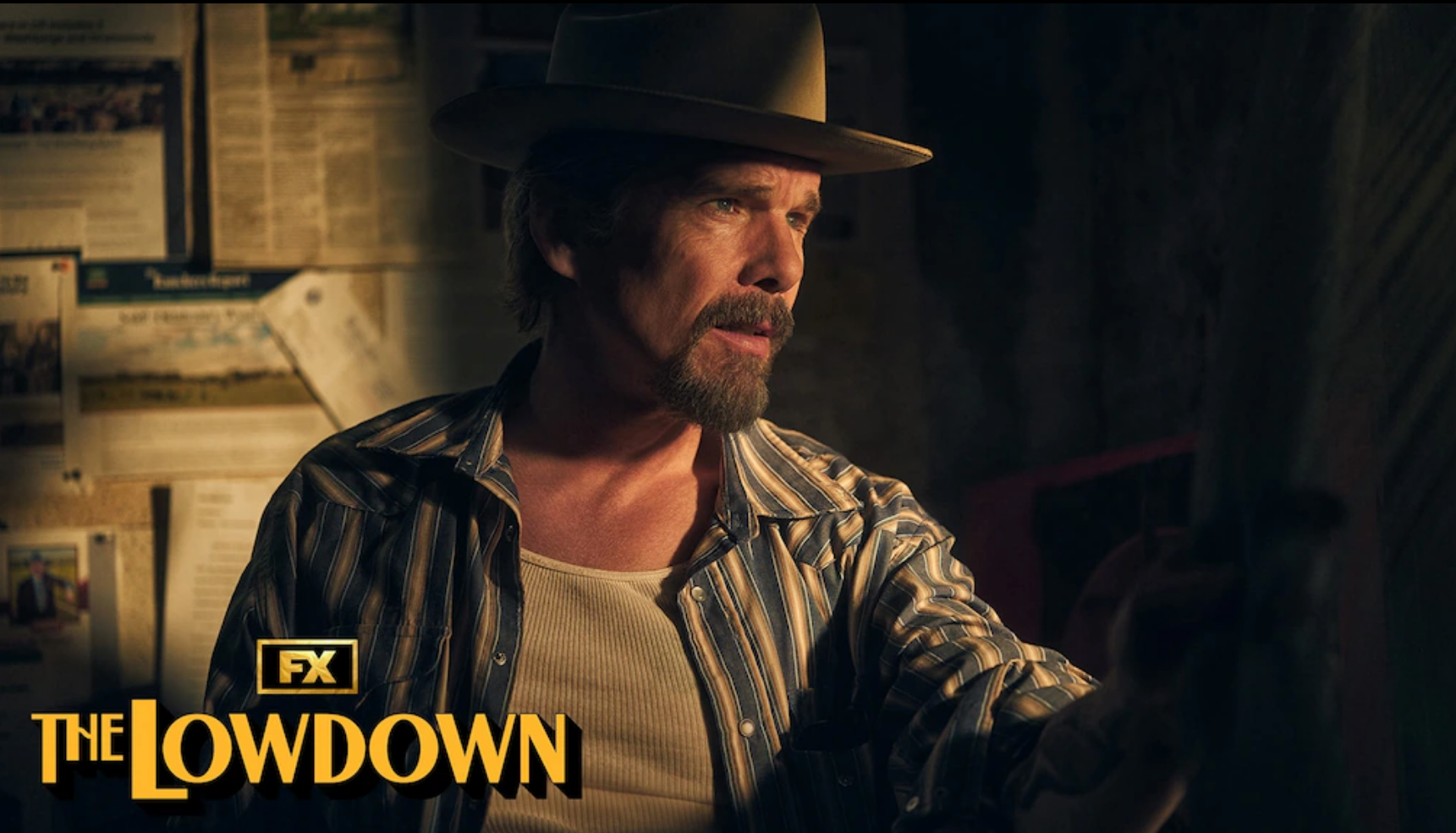 Ethan Hawke in cowboy hat staring out window.