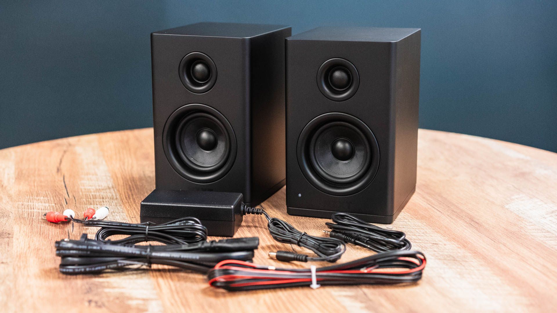 The NZXT Relay Speakers next to their cables.