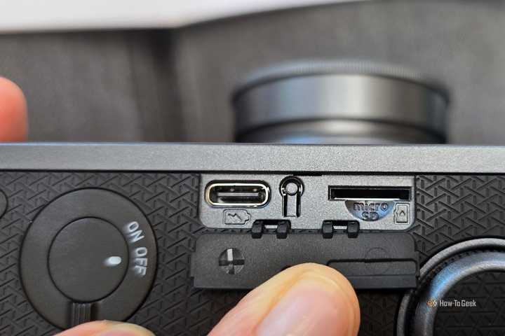 The USB-C port, reset button, and microSD card port on the Instax Wide Evo hybrid camera.