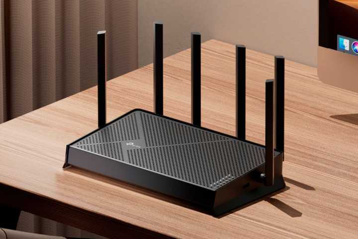 TP-Link Archer BE9700 Tri-Band Wi-Fi 7 router on a table.