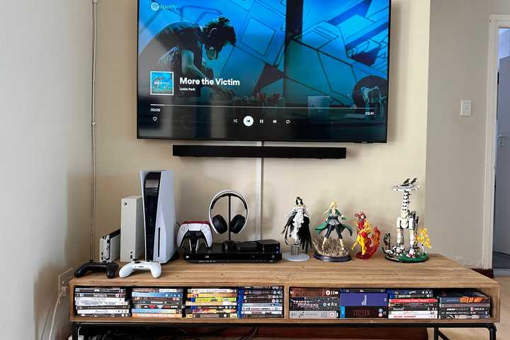 TV stand with DVDs and Blu-rays.