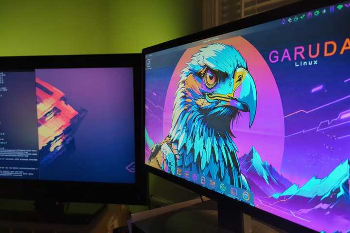 Two computer screens showing Garuda Linux desktops.