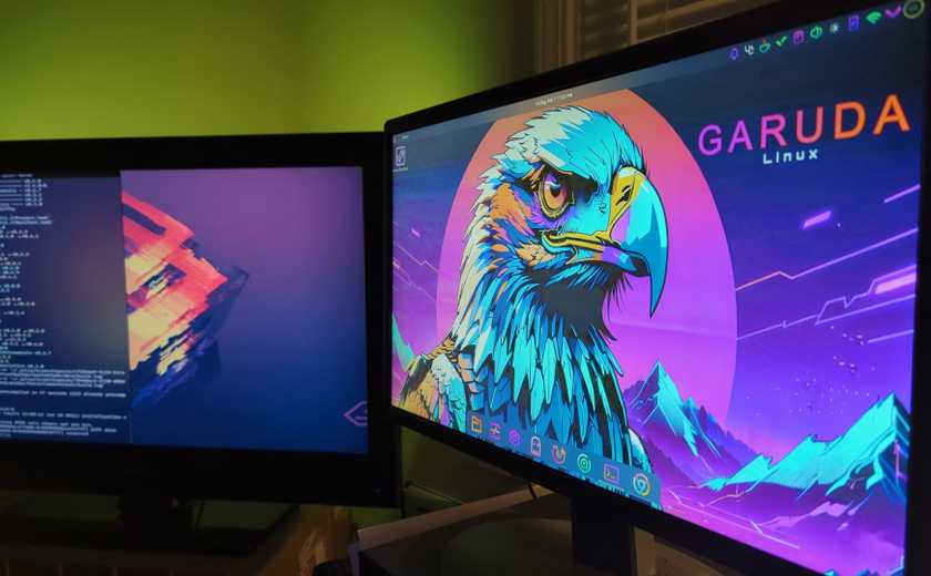 Two computer screens showing Garuda Linux desktops.