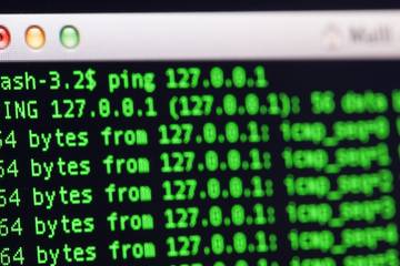 UNIX bash shell with the ping command in a green color on black background.