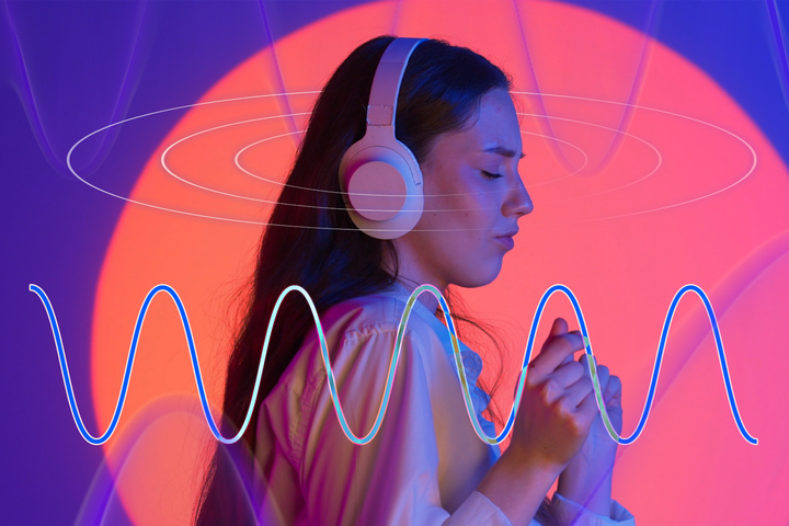 Woman wearing headphones with sound waves around her.