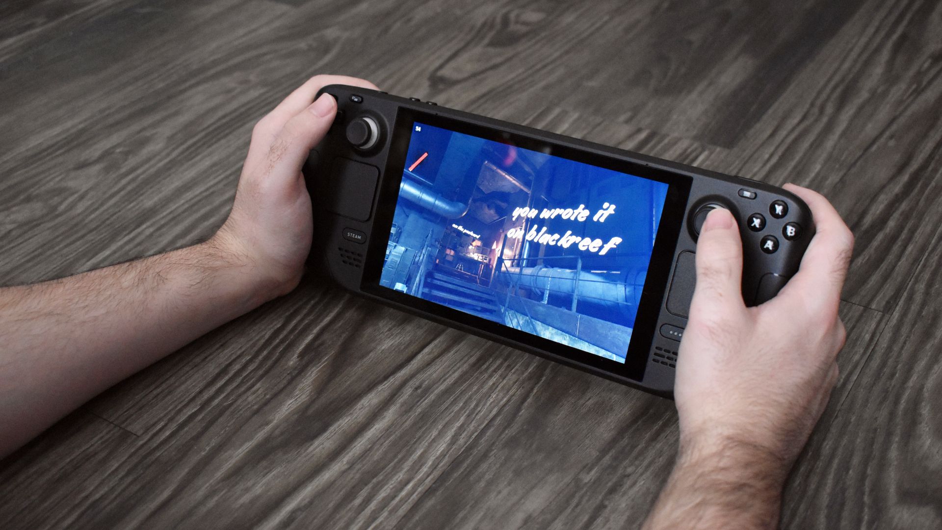 Person playing video game on Valve Steam Deck.