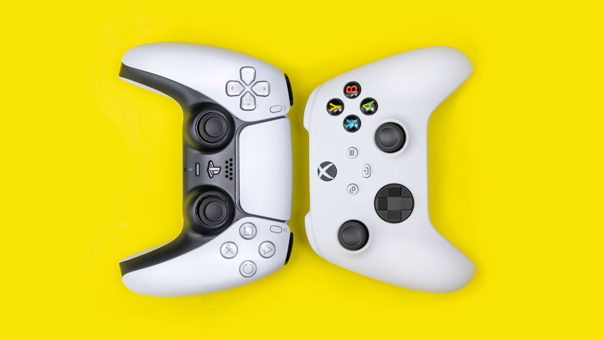 PS5 and Xbox Series X controllers on a yellow background.