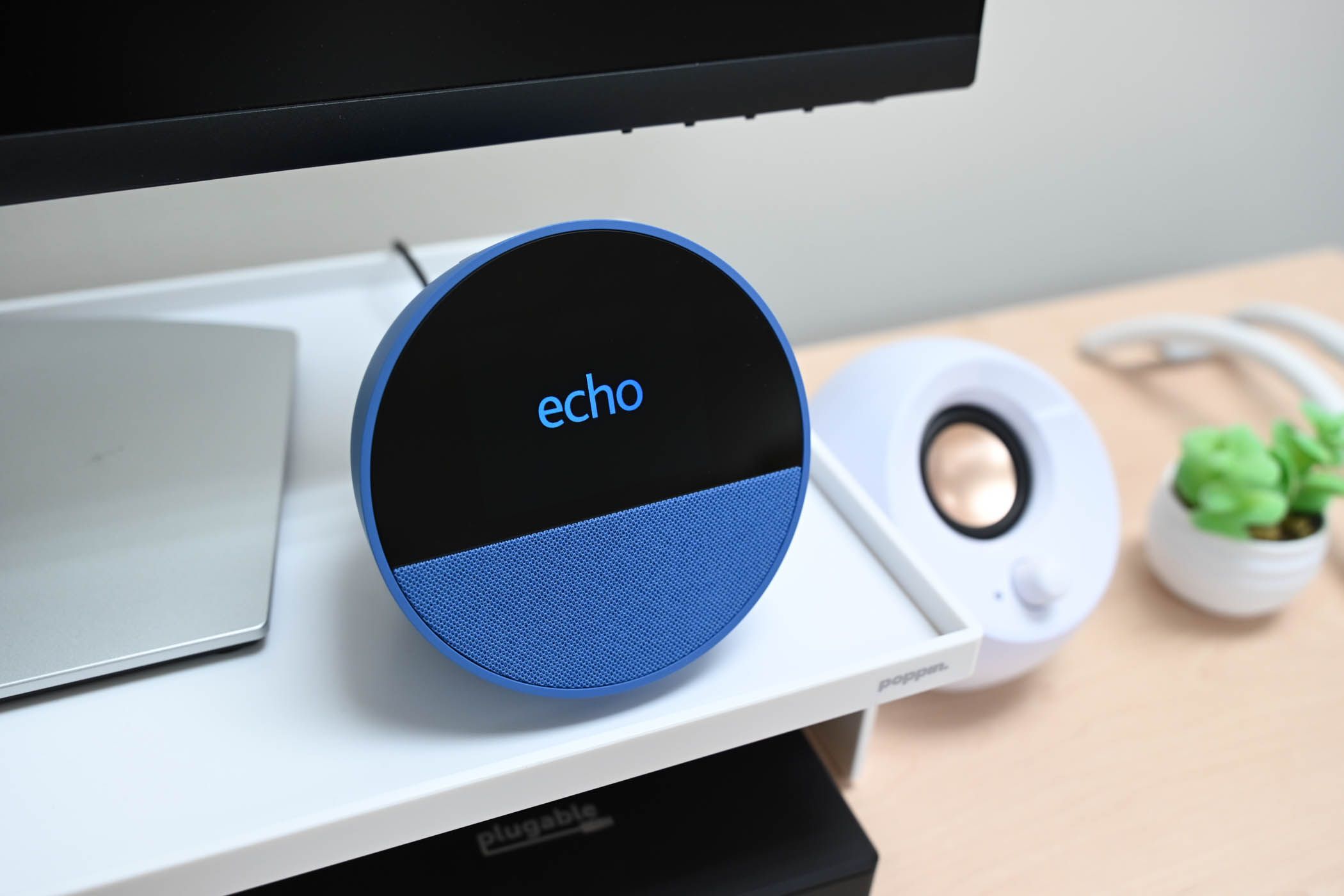 The Echo logo on the Amazon Echo Spot.
