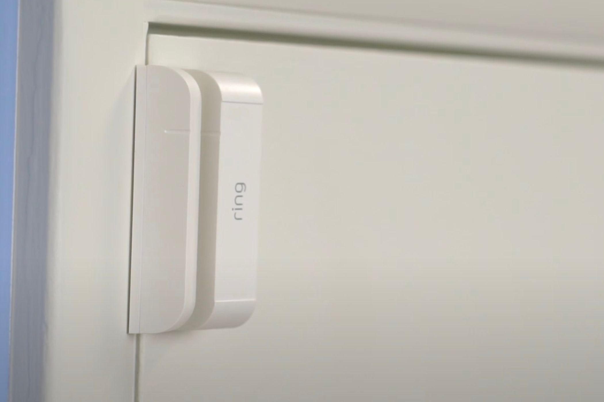 A ring contact sensor installed on a door. 