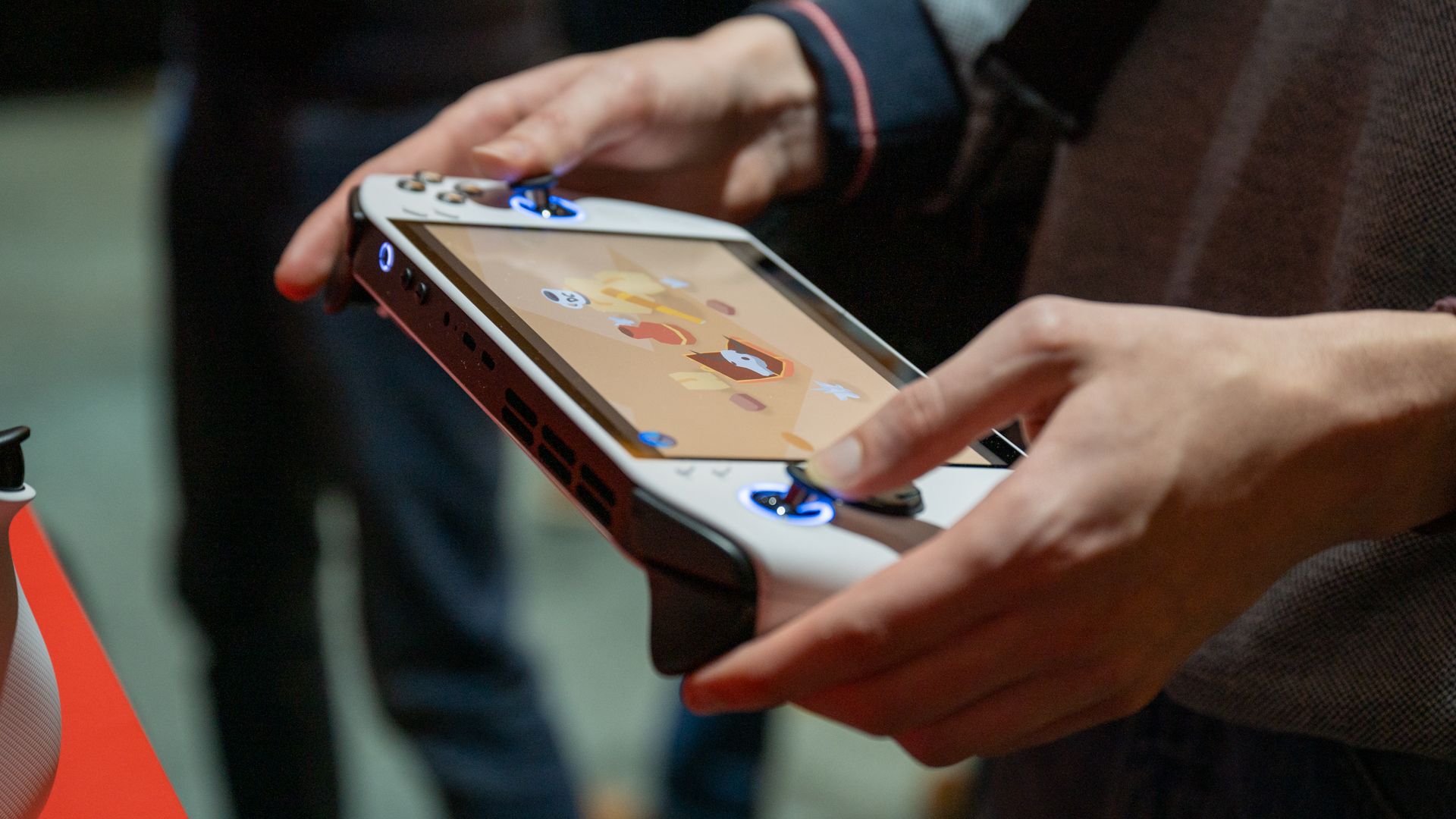Person playing a game on the Lenovo Legion Go S (8”, 1).