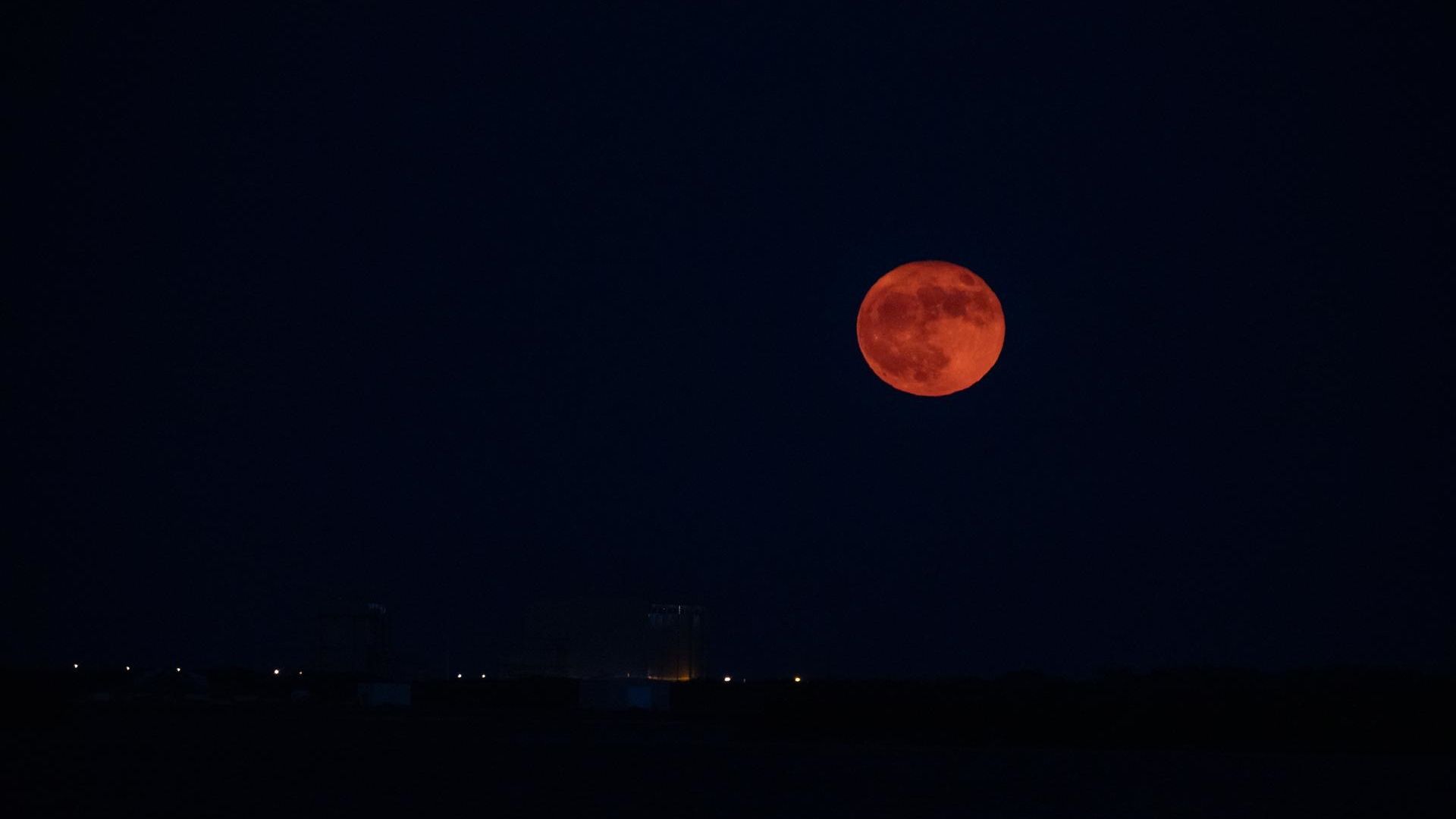 A super blue Moon rises above Kennedy Space Center in Florida
