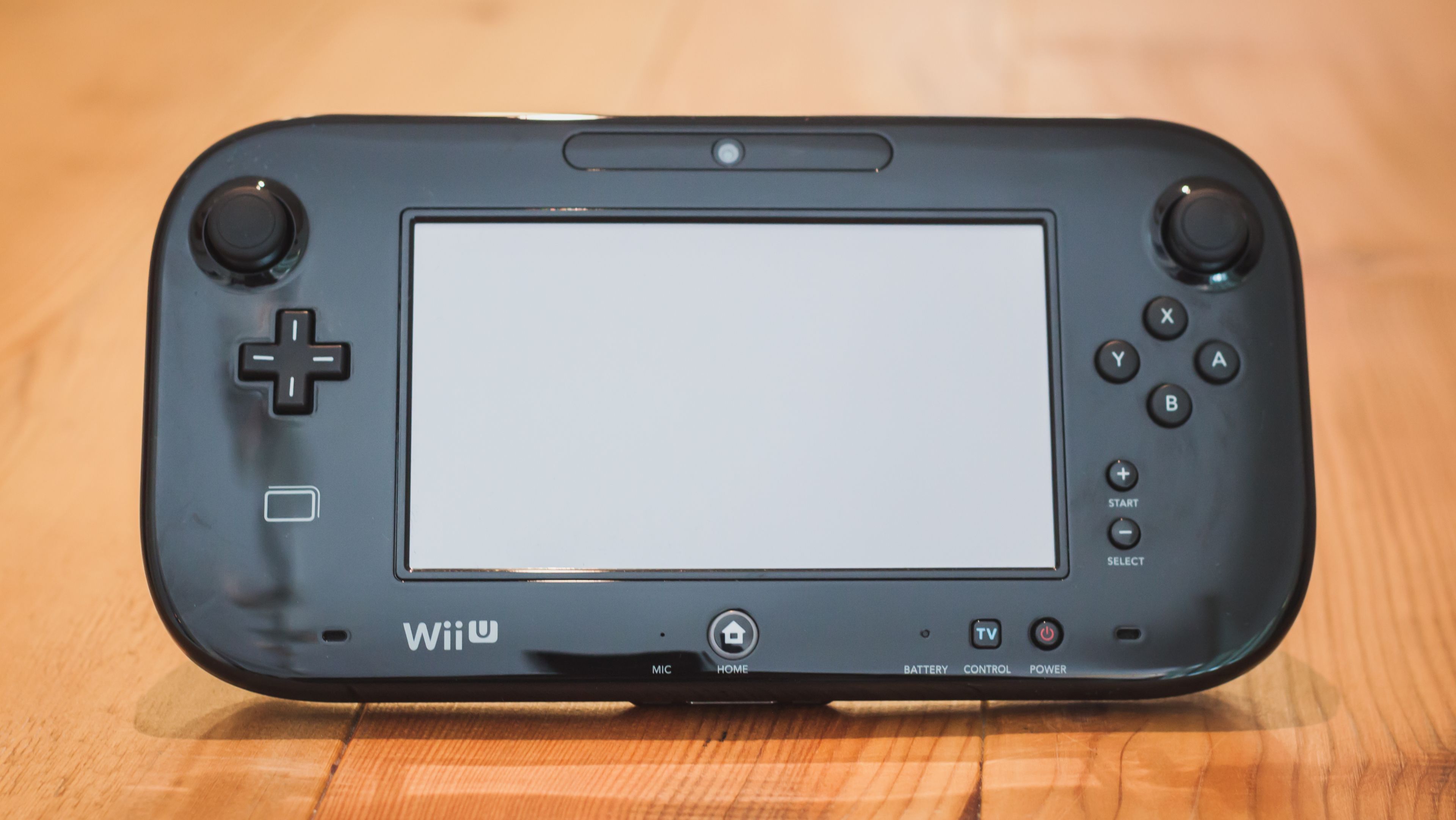 A closeup shot of the Wii U GamePad in black.