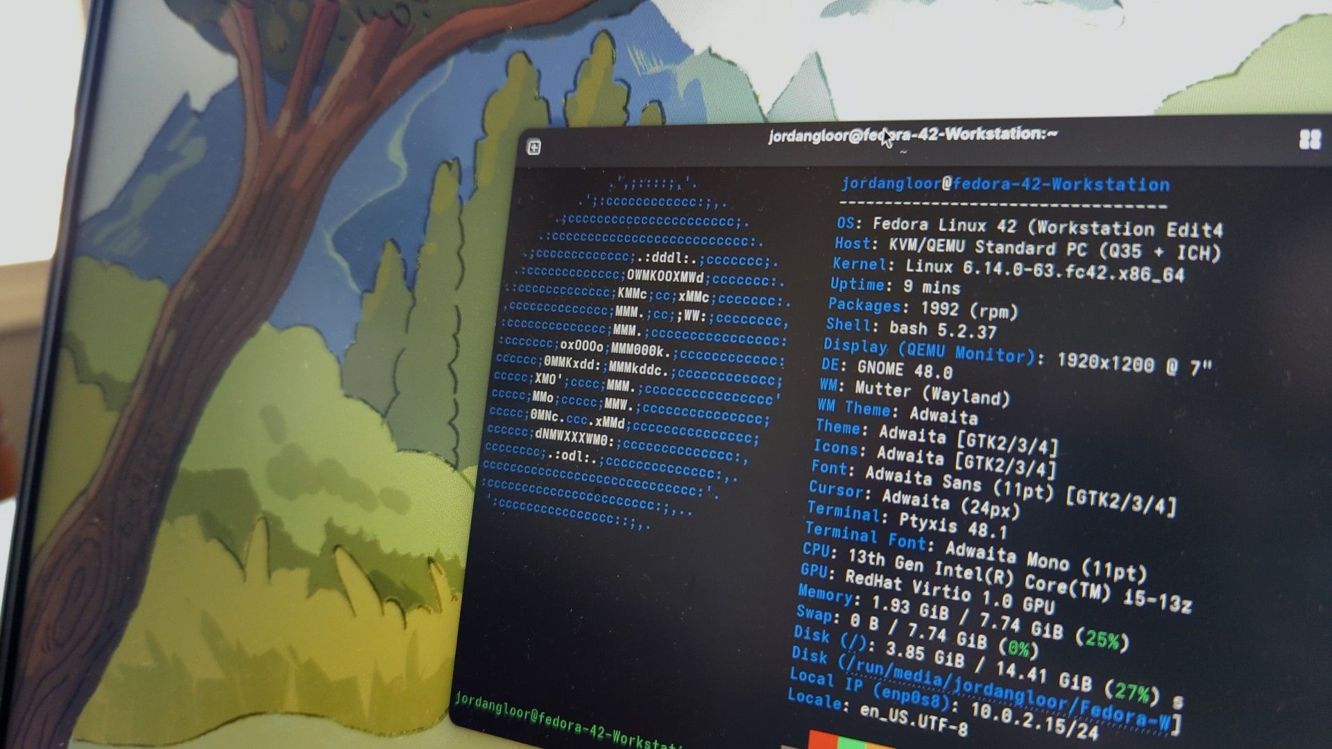 A laptop screen showing Fedora Linux 42 with a terminal open.