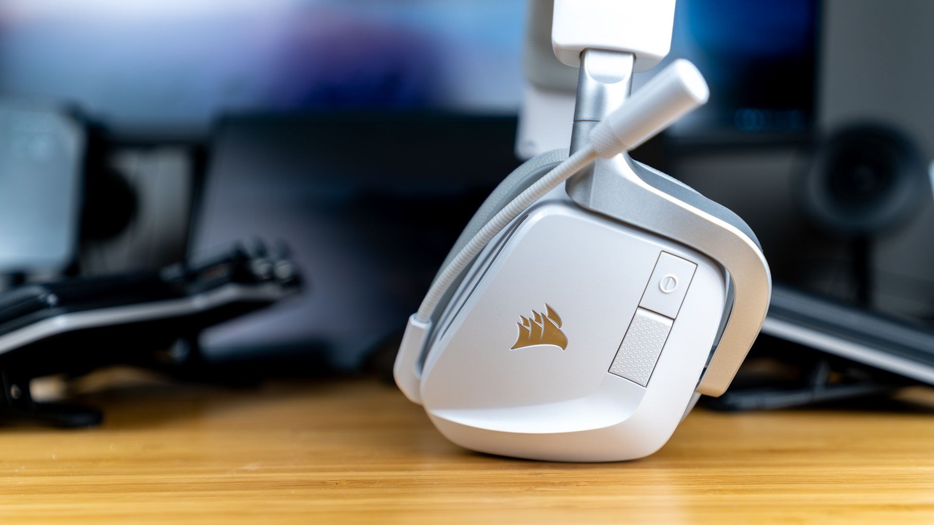The CORSAIR Void Wireless V2 gaming headset sitting on a desk.