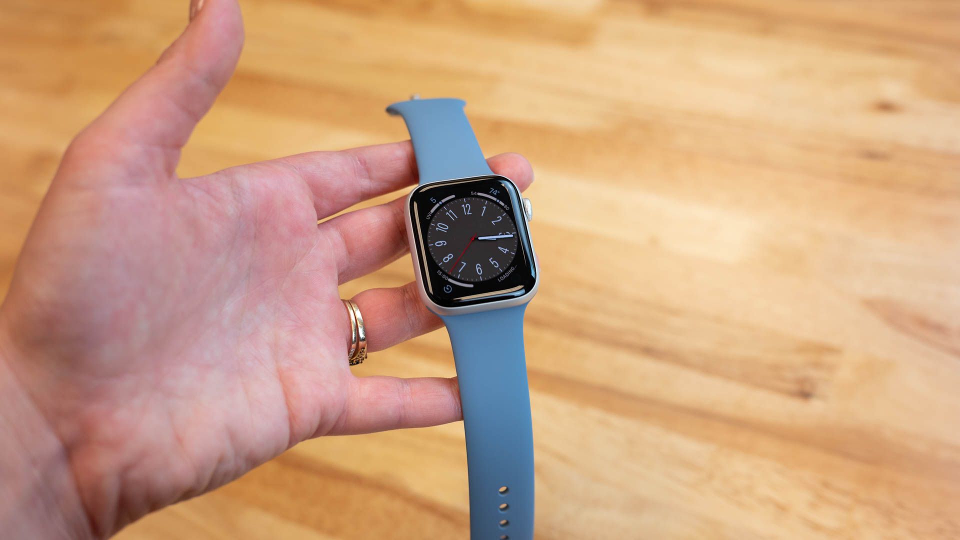 Apple watch in hand.