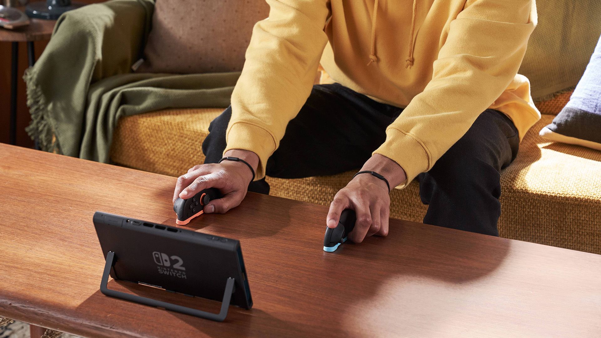 Person playing Nintendo Switch 2 in dual mouse mode