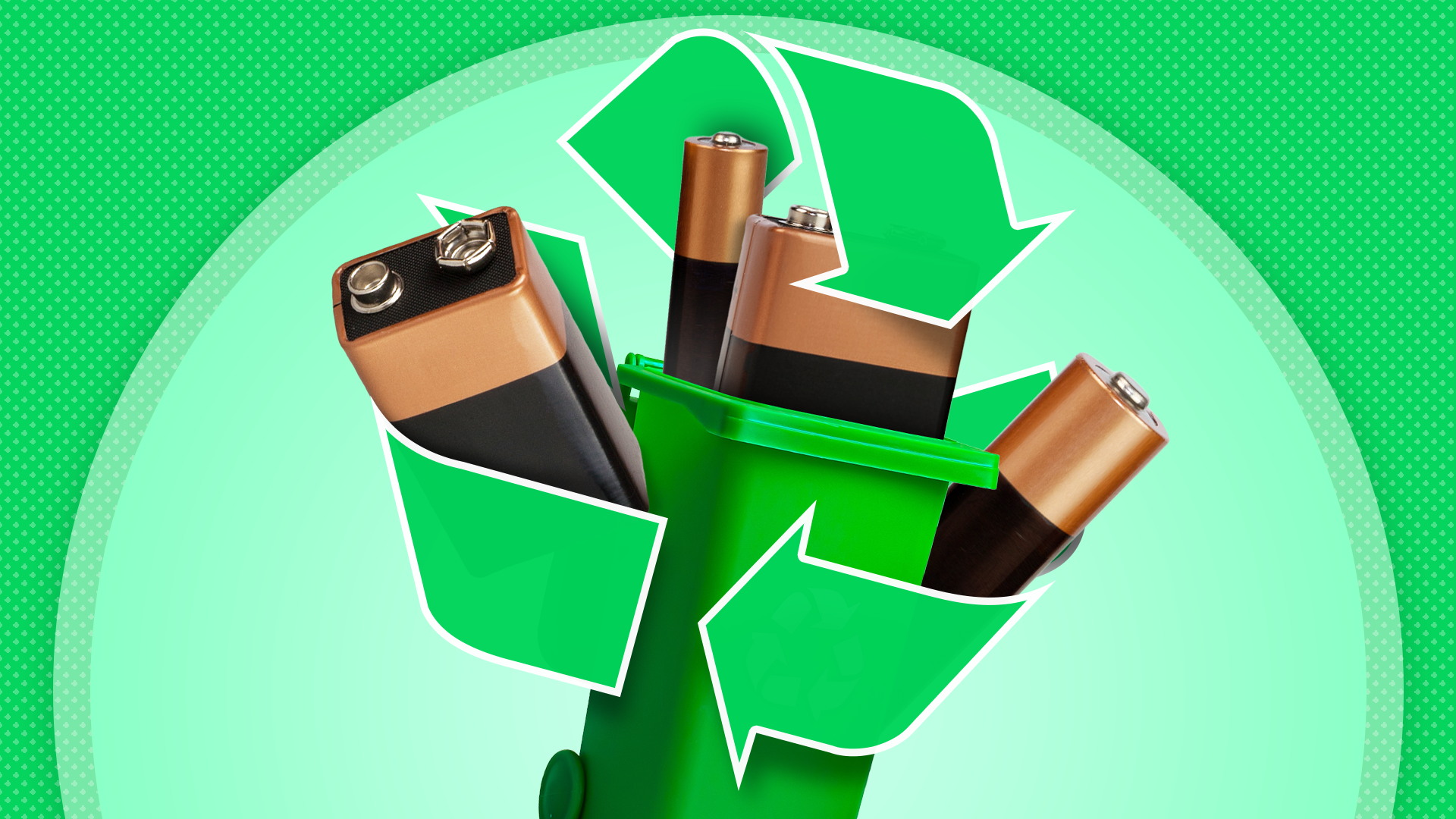 Some batteries in a green recycle bin with a recycling icon surrounding it.