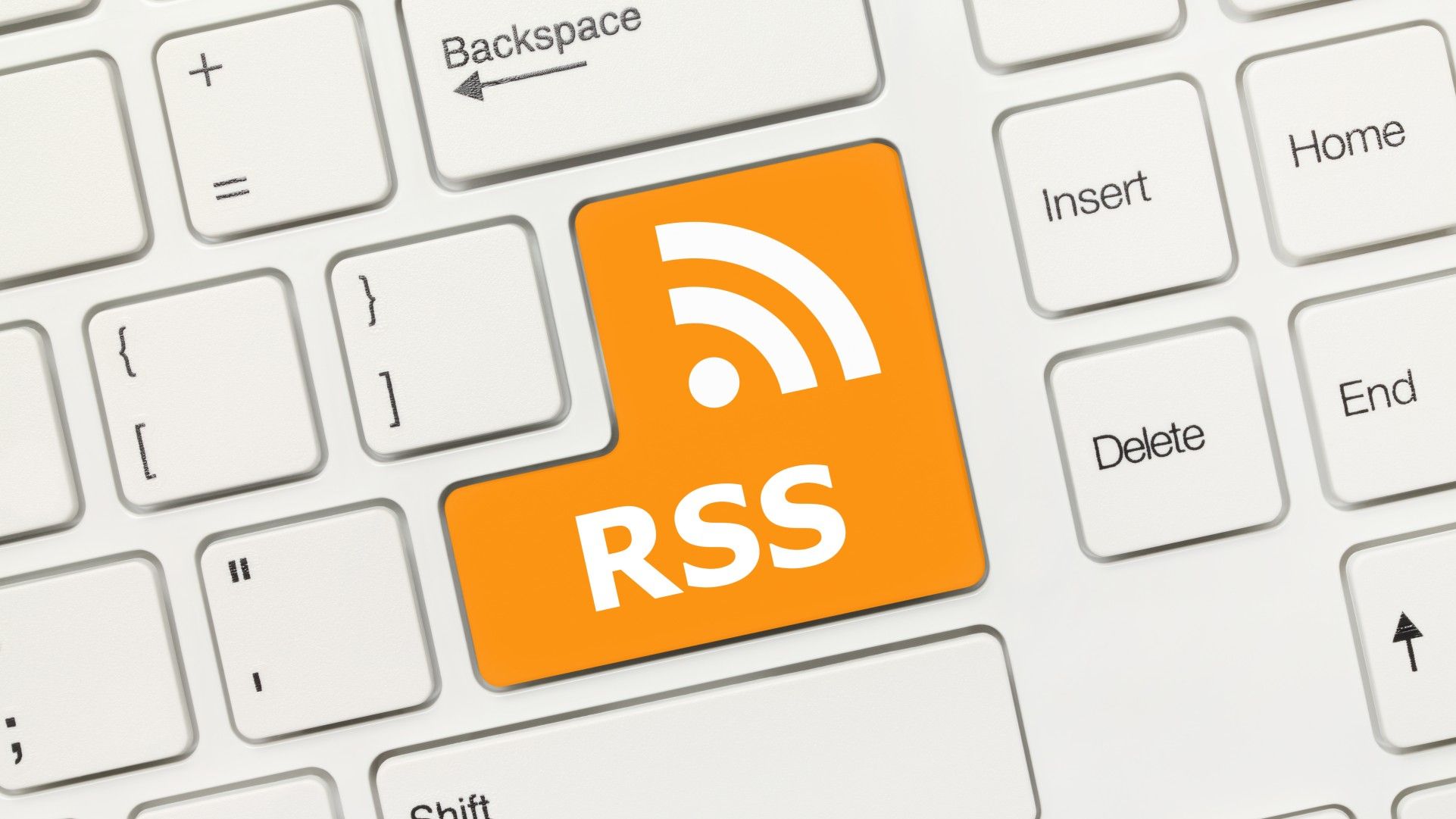 A computer keyboard with an orange RSS key in place of the Enter key.
