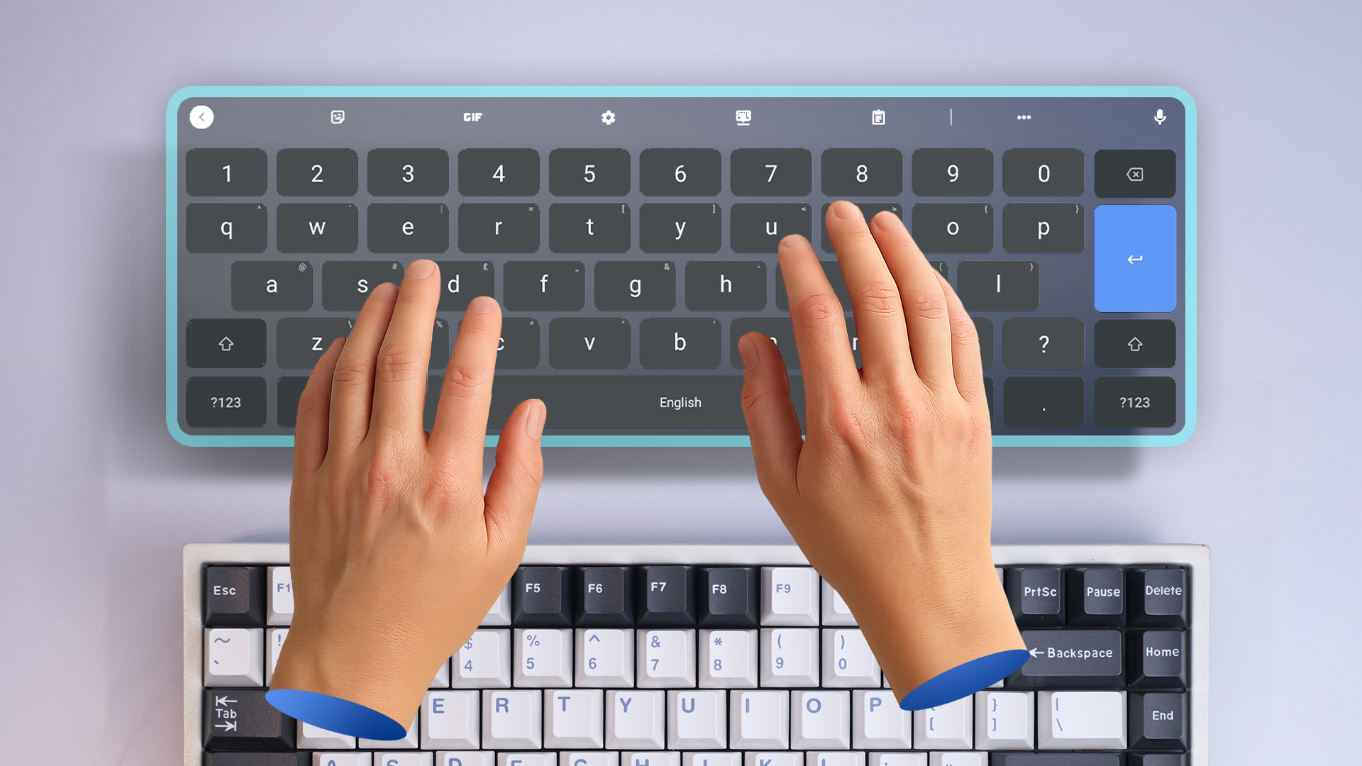 A hand typing on a virtual keyboard with a mechanical keyboard below.