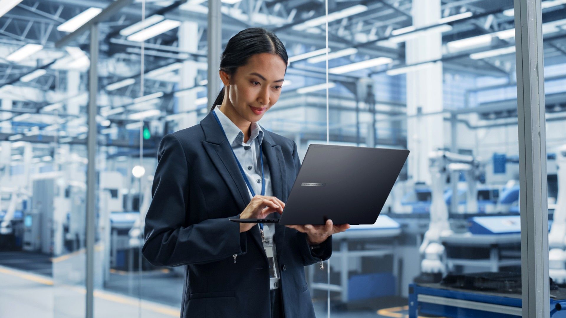 ASUS ExpertBook B5 being used by a business person near important equipment
