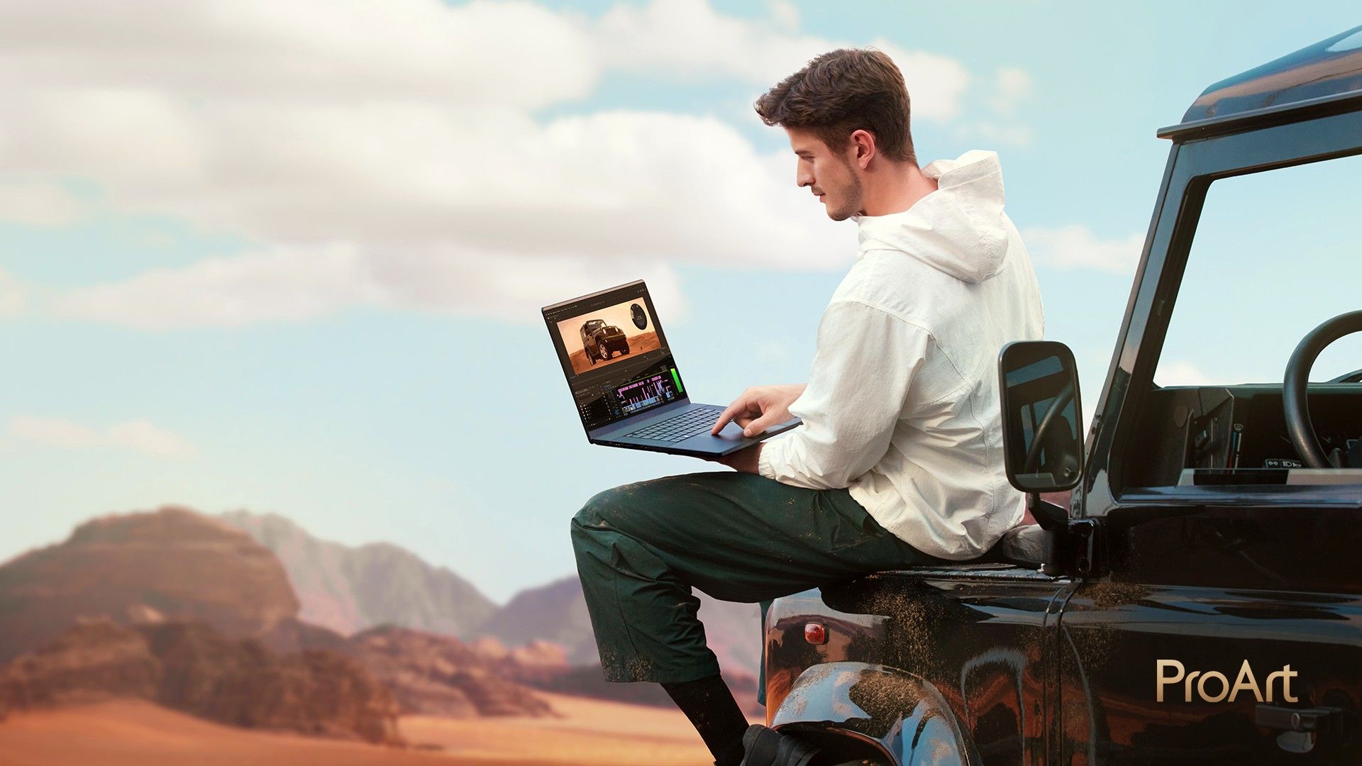 ASUS ProArt P16 laptop in use by a guy on a jeep.