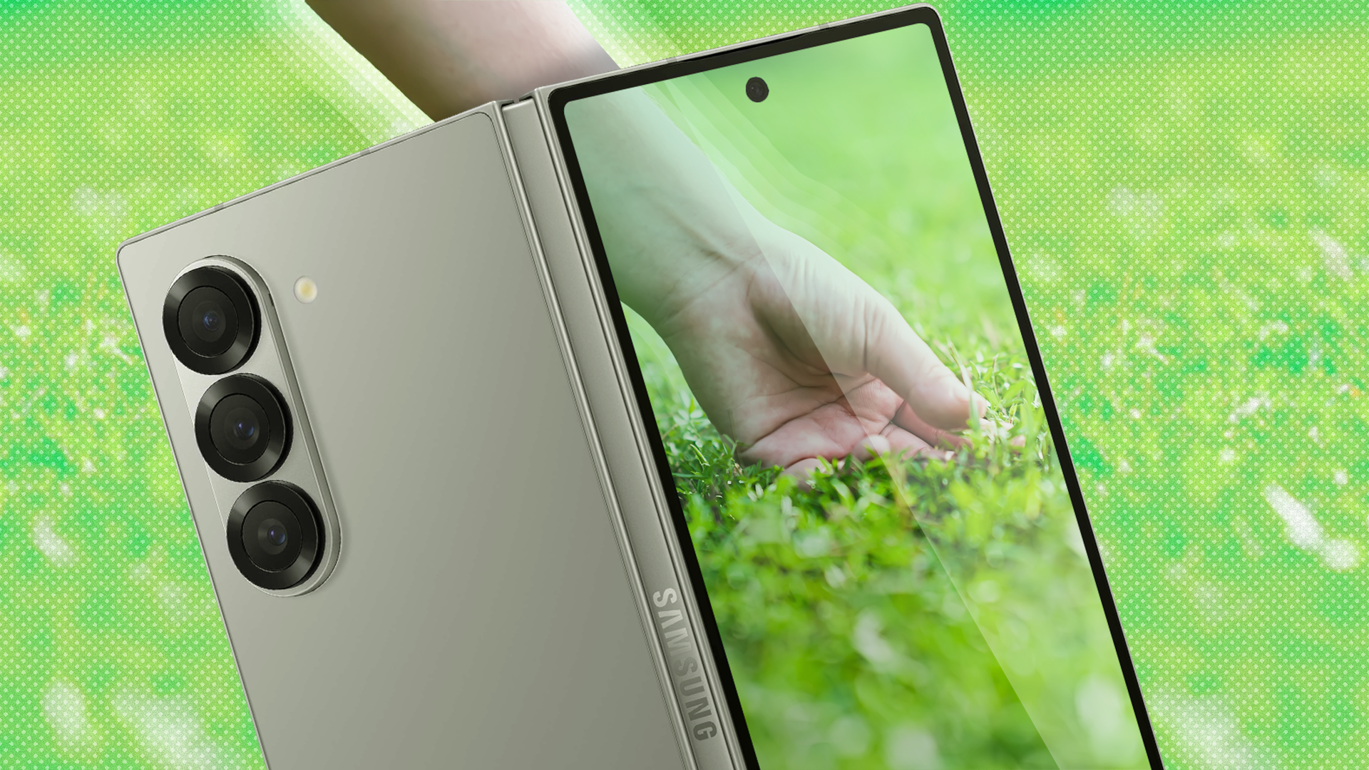 Foldable phone screen showing a hand touching the grass.