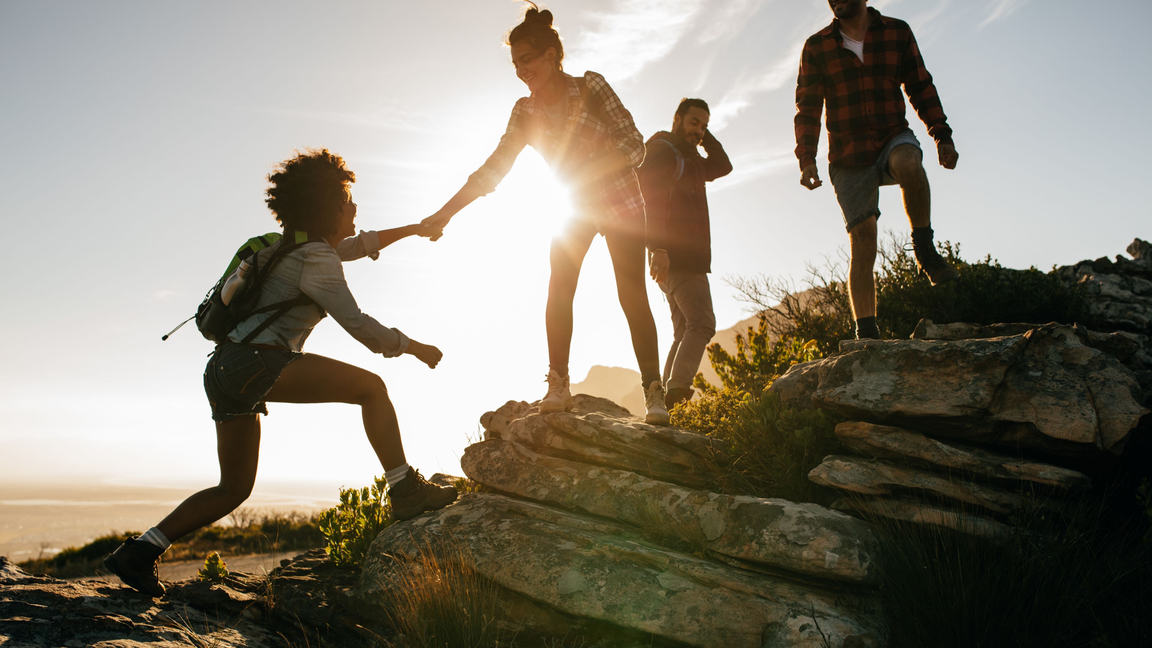 Group of people hiking in the summer.